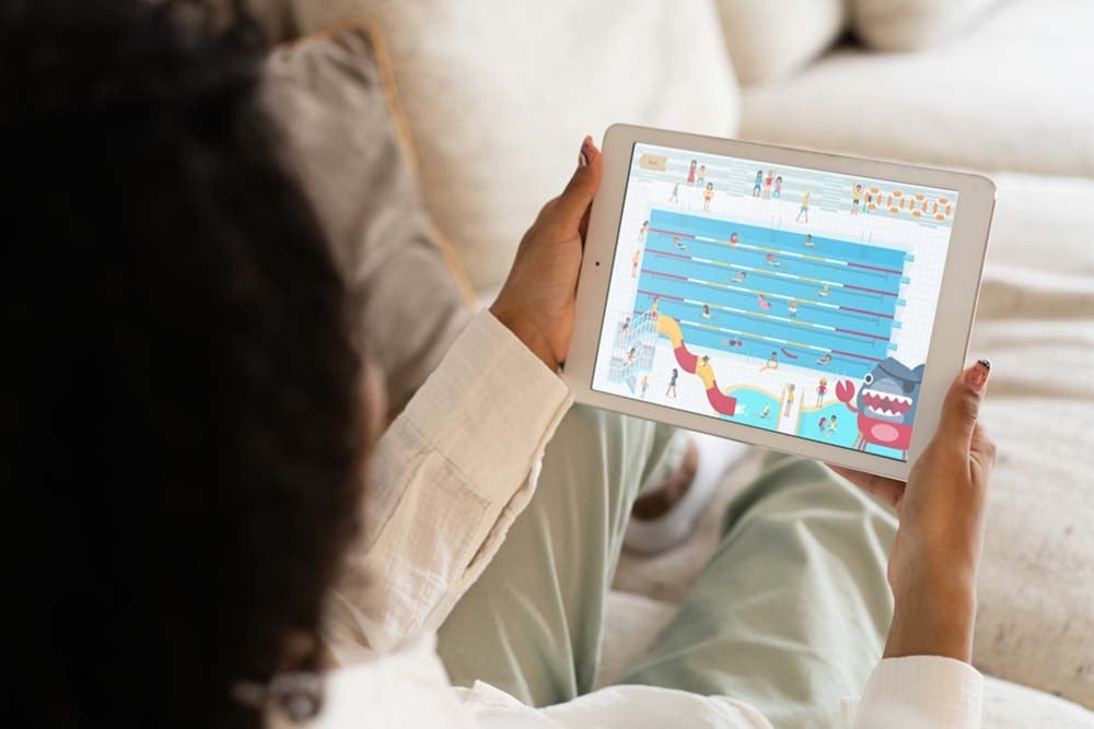 Person using an interactive learning app on a tablet