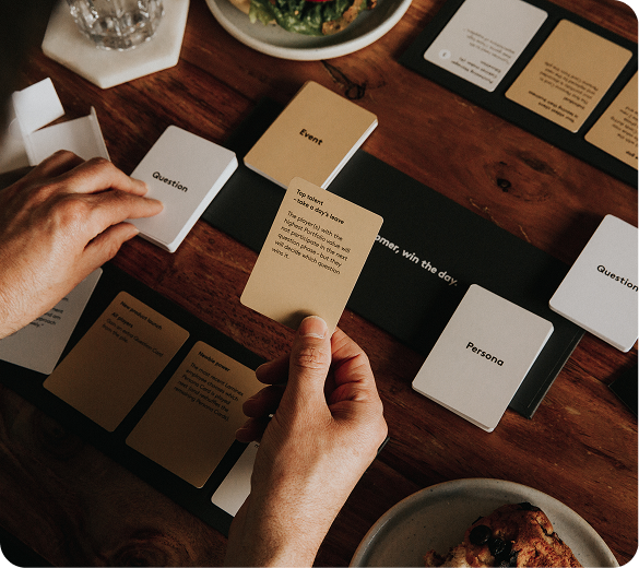 Hands holding cards from a learning card game