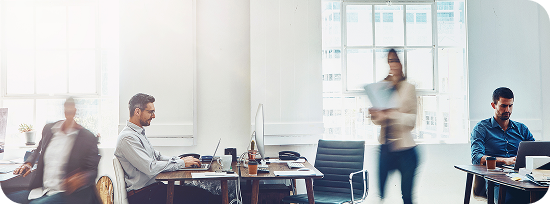 Open-plan office with people at their desks