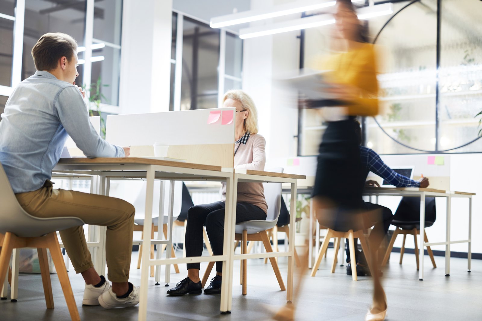 People working together in a bright, open-plan office